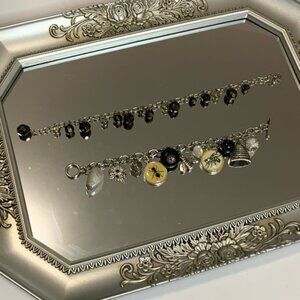 One amber bracelet, and one beehive bracelet